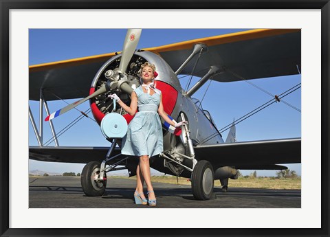 Framed Elegant 1940&#39;s style pin-up girl standing in front of an F3F biplane Print