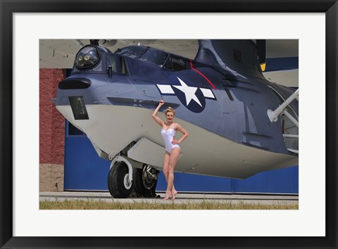 Framed pin-up girl posing with a Catalina seaplane Print