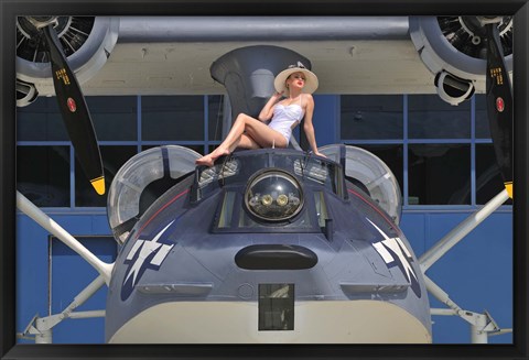 Framed Retro pin-up girl posing with a World War II era PBY Catalina seaplane Print