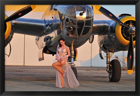 Framed Sexy 1940&#39;s pin-up girl in lingerie posing with a B-25 bomber Print