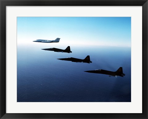 Framed Three F-5E Tiger IIs fly in formation with a Learjet 25 Print