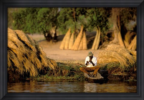 Framed Local Man Fishing and Piles of Straw for Hatch, Okavango Delta, Botswana Print