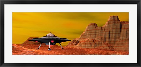 Framed UFO landing on a desert landscape Print