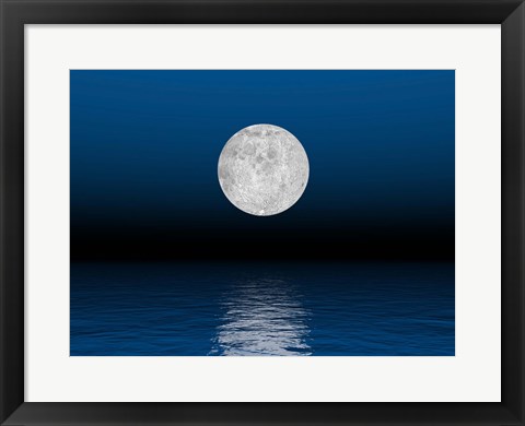 Framed Beautiful full moon against a deep blue sky over the ocean Print