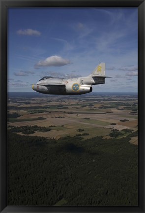 Framed Saab J 29 jet fighter flying over landscape Print