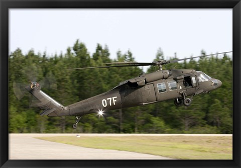 Framed US Army UH-60L Blackhawk helicopter landing at Florida Airport Print