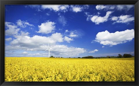 Framed Wind turbine in a canola field against cloudy sky, Denmark Print