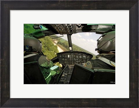 Framed Two instructor pilots practice low flying operations in a UH-1H Huey helicopter Print