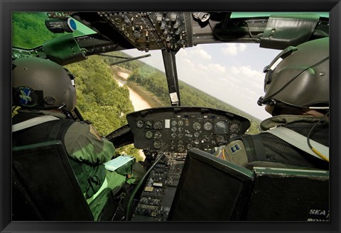 Framed Two instructor pilots practice low flying operations in a UH-1H Huey helicopter Print