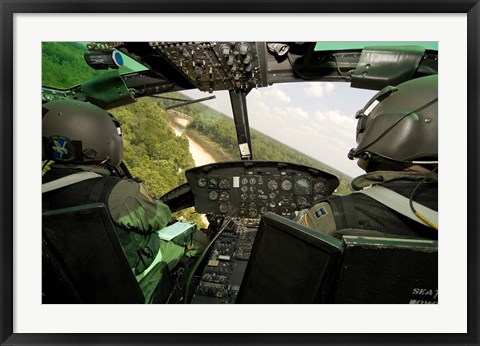 Framed Two instructor pilots practice low flying operations in a UH-1H Huey helicopter Print