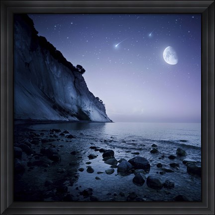 Framed Rising moon over ocean and mountains against starry sky Print