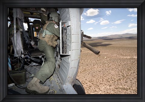 Framed HH-60G Pave Hawk gunner fires his GAU-17 machine gun Print