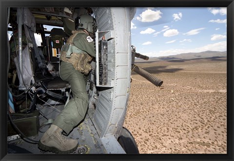 Framed HH-60G Pave Hawk gunner fires his GAU-17 machine gun Print