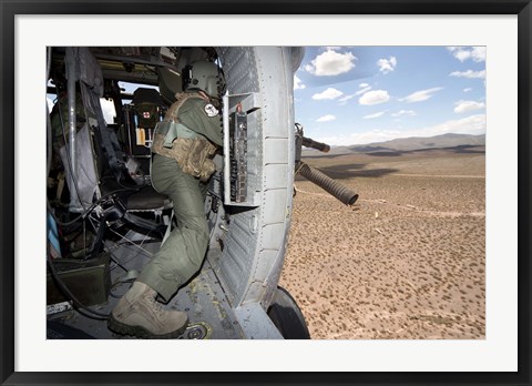 Framed HH-60G Pave Hawk gunner fires his GAU-17 machine gun Print