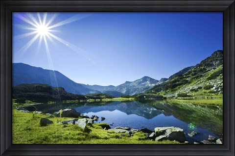 Framed Muratov Lake against blue sky and bright sun in Pirin National Park, Bulgaria Print
