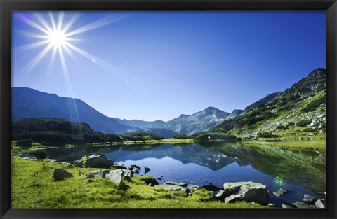 Framed Muratov Lake against blue sky and bright sun in Pirin National Park, Bulgaria Print