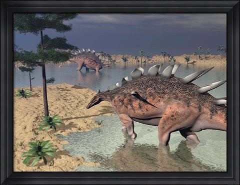 Framed Kentrosaurus dinosaurs walking in the water next to sand and trees Print