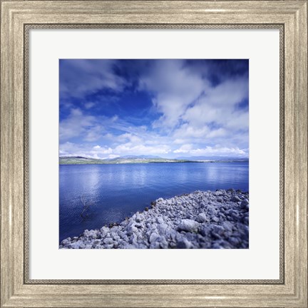 Framed Tranquil lake and rocky shore against cloudy sky, Sardinia, Italy Print