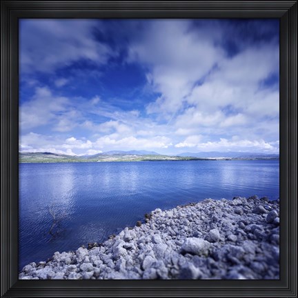 Framed Tranquil lake and rocky shore against cloudy sky, Sardinia, Italy Print