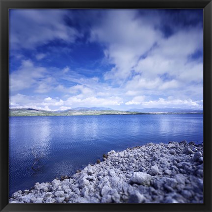 Framed Tranquil lake and rocky shore against cloudy sky, Sardinia, Italy Print