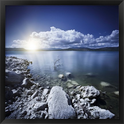 Framed Tranquil lake and rocky shore with sun over horizon, Sardinia, Italy Print