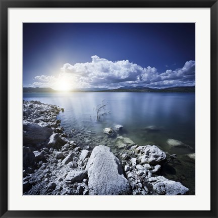 Framed Tranquil lake and rocky shore with sun over horizon, Sardinia, Italy Print