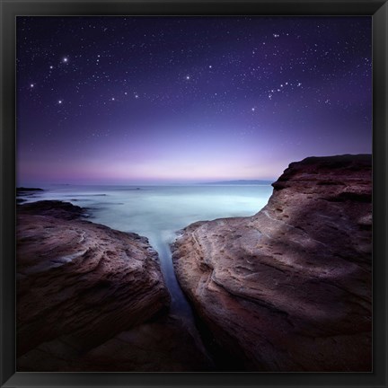 Framed Two large rocks in a sea, against starry sky Print