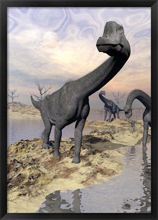 Framed Brachiosaurus dinosaurs near water with reflection by sunset and full moon Print