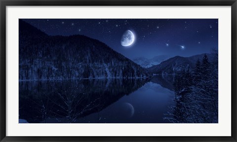 Framed Moon rising over tranquil lake in the misty mountains against starry sky Print