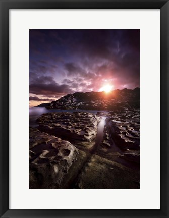 Framed Rocky shore and tranquil sea against cloudy sky at sunset, Sardinia, Italy Print