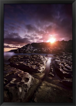 Framed Rocky shore and tranquil sea against cloudy sky at sunset, Sardinia, Italy Print