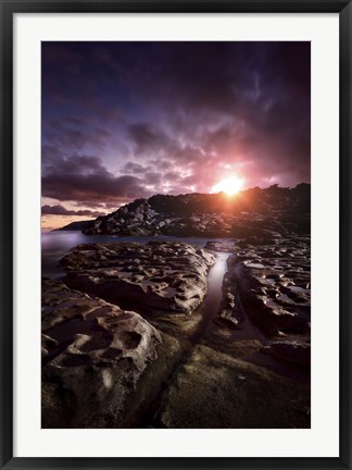 Framed Rocky shore and tranquil sea against cloudy sky at sunset, Sardinia, Italy Print