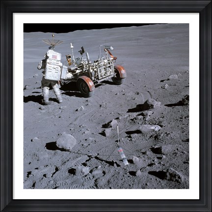 Framed Astronaut walking near the lunar rover on the moon, Apollo 16 Print