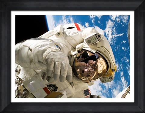 Framed Astronaut taking a spacewalk Print