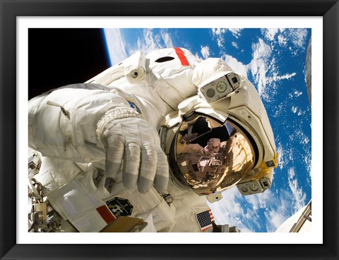 Framed Astronaut taking a spacewalk Print