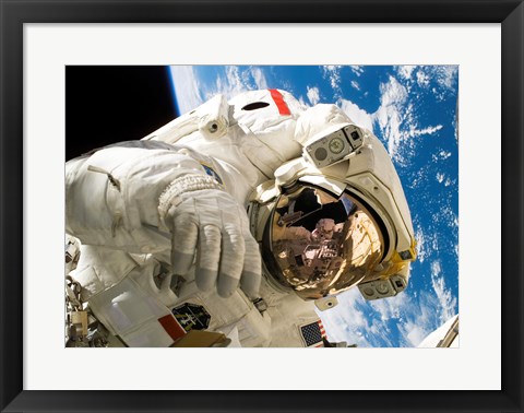 Framed Astronaut taking a spacewalk Print