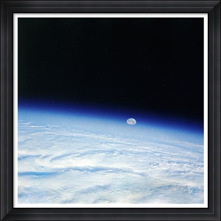 Framed Outer space shot of storm system in early stage of formation with moon in background Print