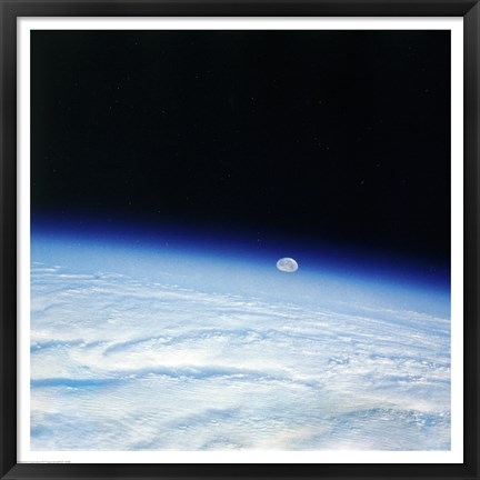 Framed Outer space shot of storm system in early stage of formation with moon in background Print