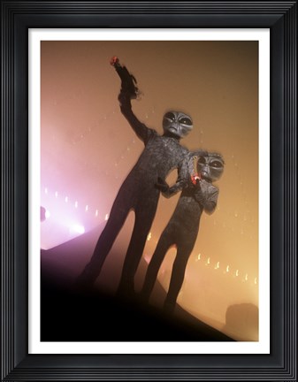 Framed Alien Aiming a Gun Print