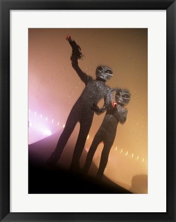 Framed Alien Aiming a Gun Print