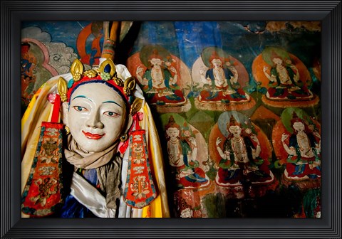 Framed Religious statue infront of Buddha mural at Shey Palace, Ladakh, India Print