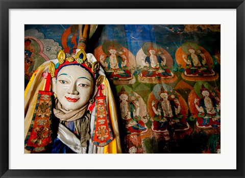 Framed Religious statue infront of Buddha mural at Shey Palace, Ladakh, India Print