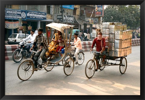 Framed People and cargo move through streets via rickshaw, Varanasi, India Print