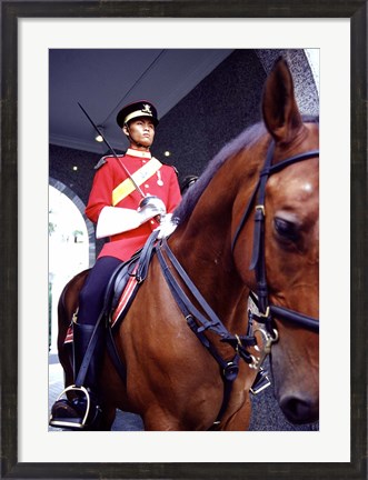 Framed Malaysia, Kuala Lumpur: a mounted guard stands in front of the Royal Palace Print