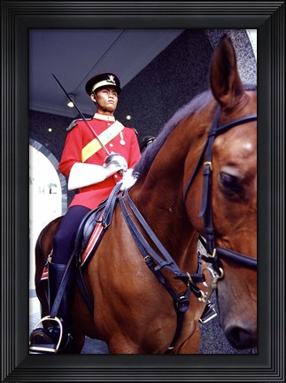Framed Malaysia, Kuala Lumpur: a mounted guard stands in front of the Royal Palace Print