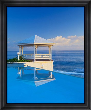Framed Gazebo reflecting on pool with sea in background, Long Island, Bahamas Print