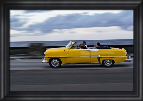 Framed 1950&#39;s era car in motion along the Malecon or seawall, Havana, Cuba Print
