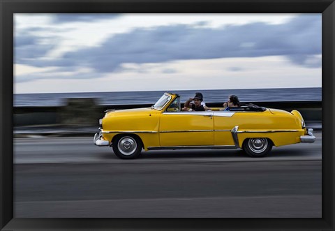 Framed 1950&#39;s era car in motion along the Malecon or seawall, Havana, Cuba Print