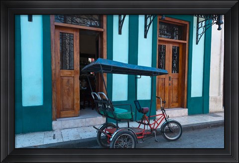 Framed Cuba, Camaquey, bike carriage and buildings Print
