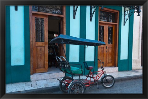 Framed Cuba, Camaquey, bike carriage and buildings Print